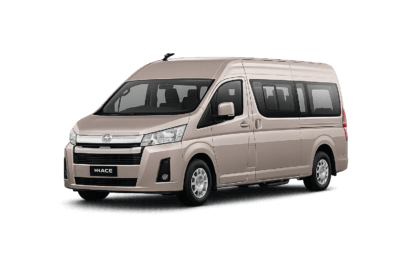 Toyota Hiace Premio Luxury coklat muda metallic tampak serong depan dan samping untuk layanan sewa Hiace Luxury Jakarta dengan driver profesional